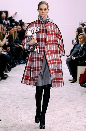 Plaid oversized cape worn with turtleneck by Celine