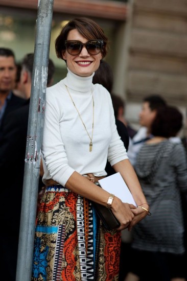 White turtleneck worn with accessories and printed skirt from The Sartorialist