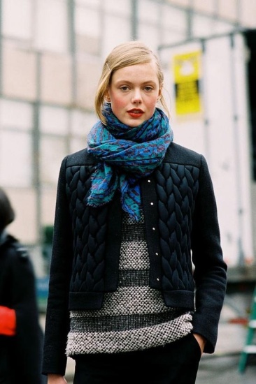 Frida Gustavsson wearing a guilted jacket worn with knitted sweater, black trousers and printed scarf!
