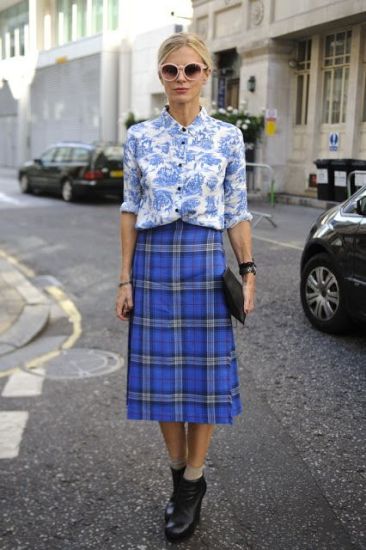 Laura Bailey wearing printed shirt, plaid midi skirt and high heel ankle boots for LFW!