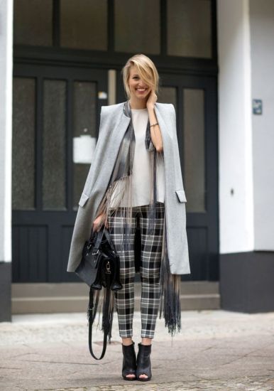 Mixing trends - long grey vest, plaid trousers, fringed scarf, leather ankle boots and a matching bag!