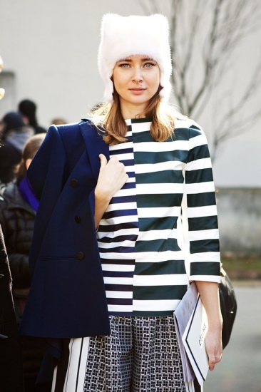 Paris Fashion Week - striped top worn with patterned trousers, white fur hat and winter coat!