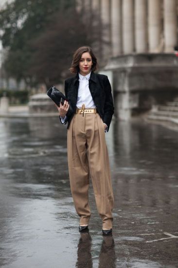 Pleated trousers with buttoned up shirt and a black jacket