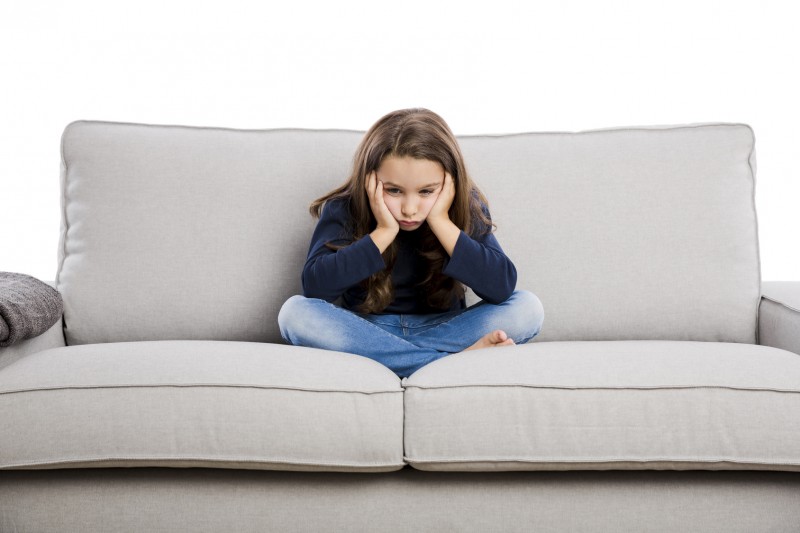 upset child on couch