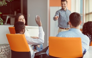 professional man raises hand in presentation