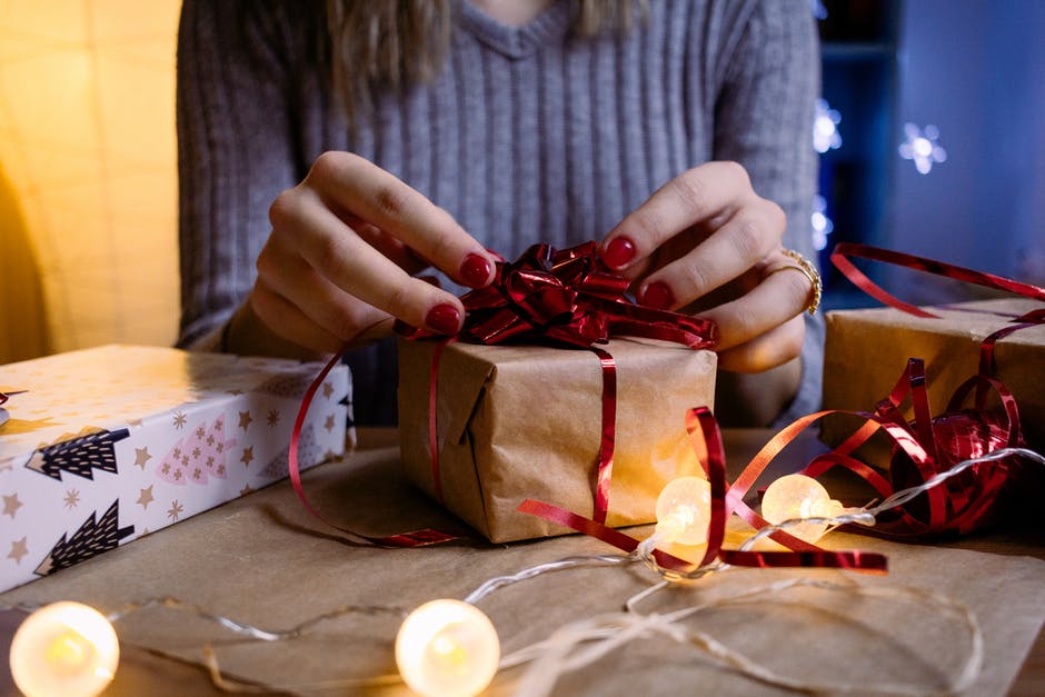 woman wrapping christmas gift