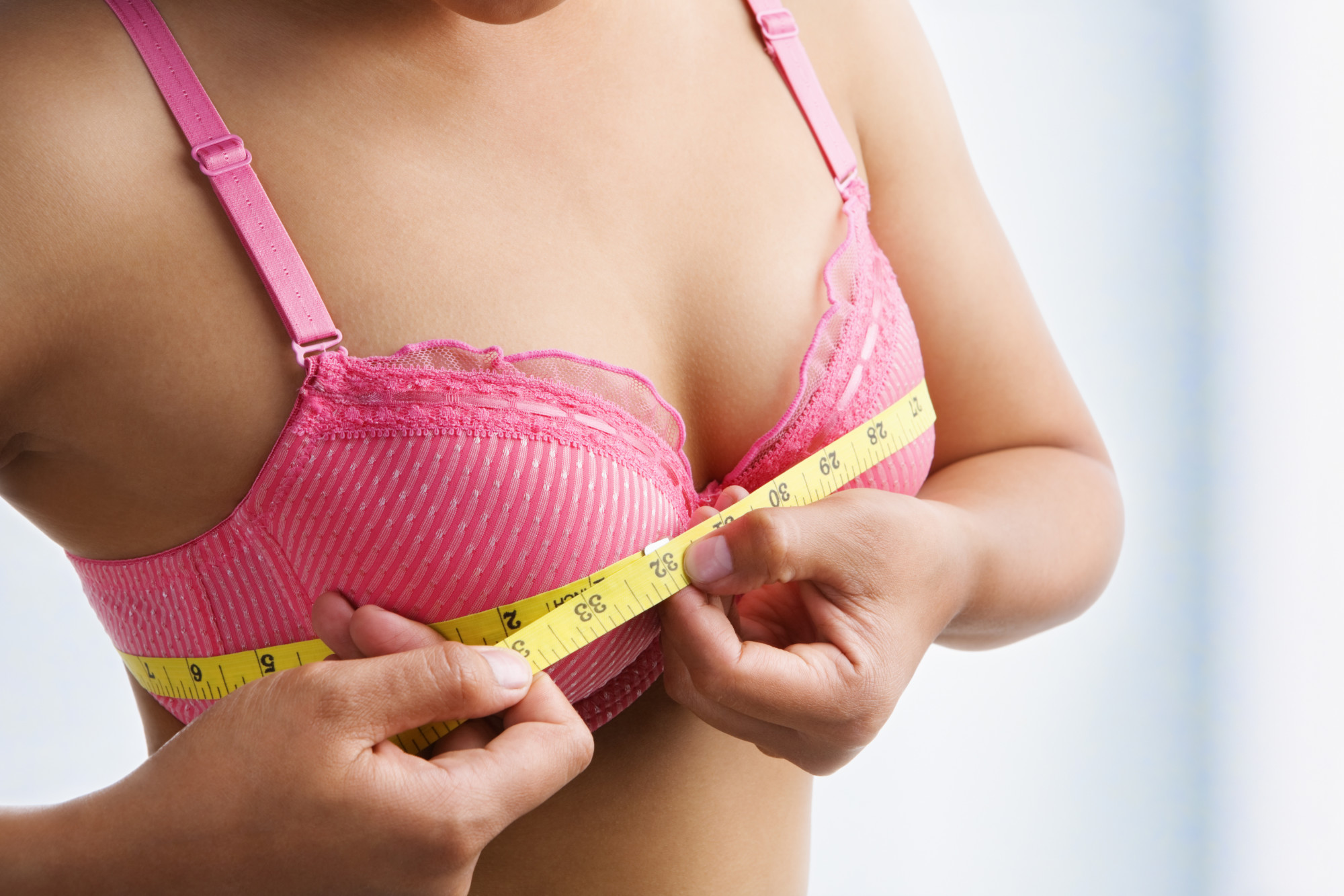 Woman Measuring Bra Size