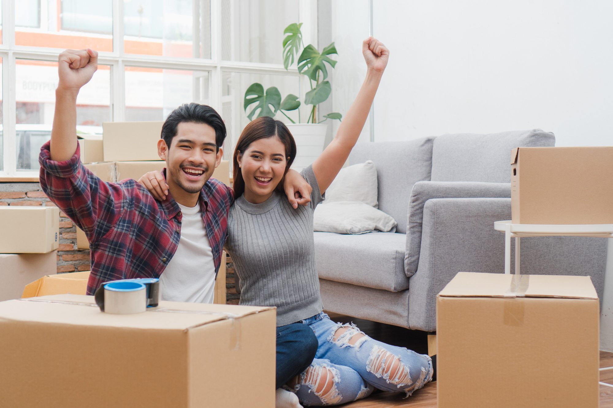 Couple in an Apartment with Boxes Packed